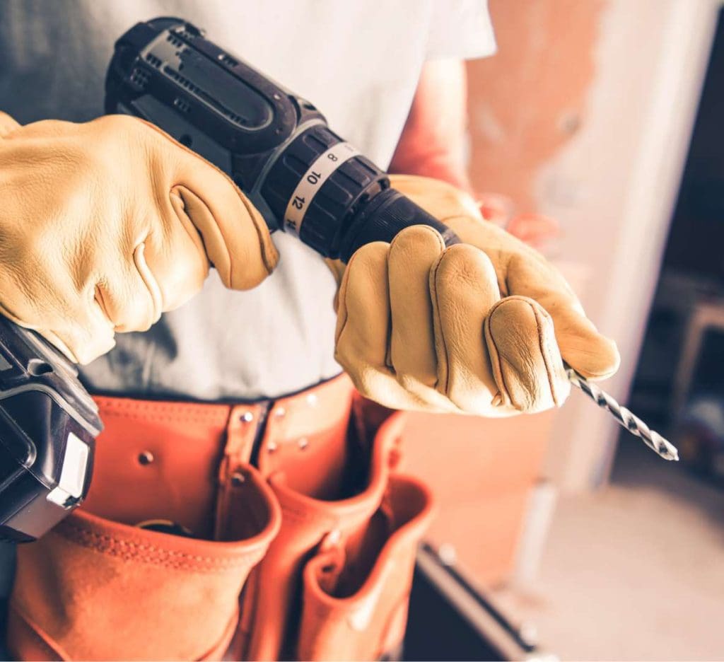 Avid Contractors Expert Holding A Drill Machine